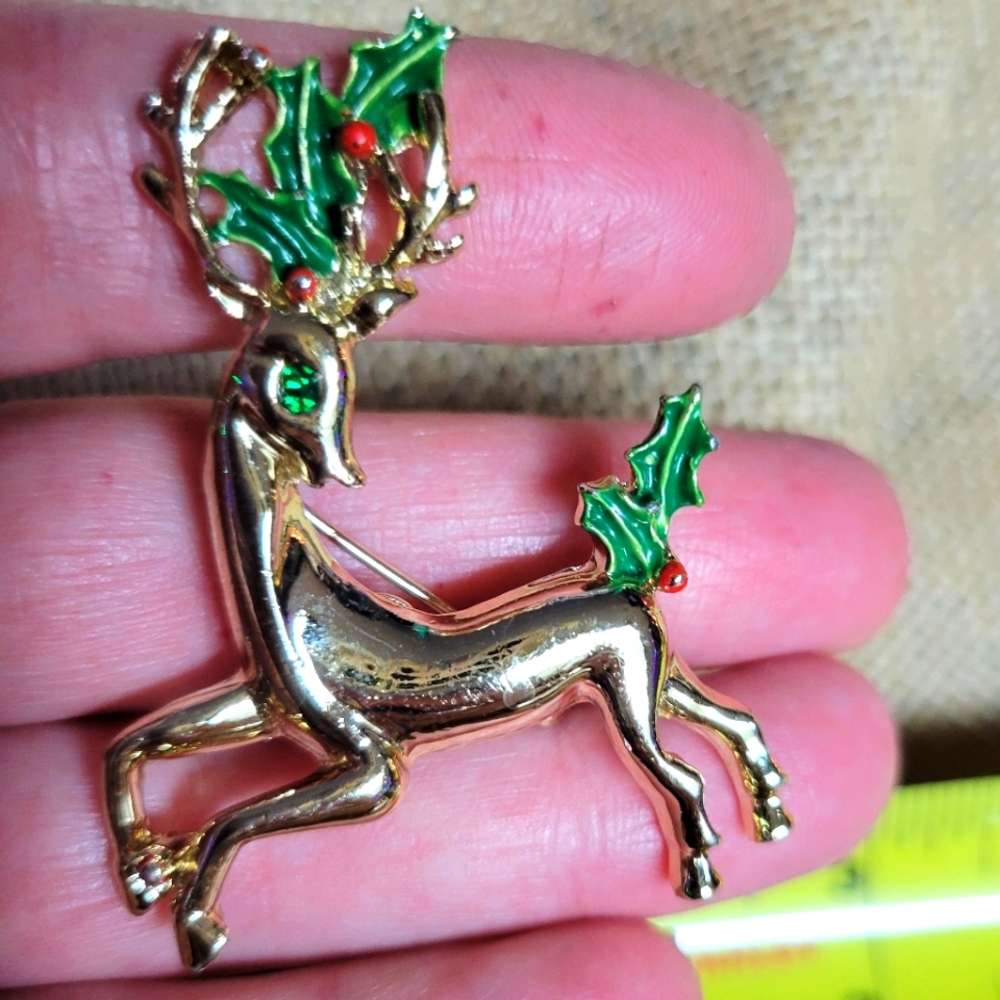 Vintage Gerrys gold tone metal reindeer brooch-red/green